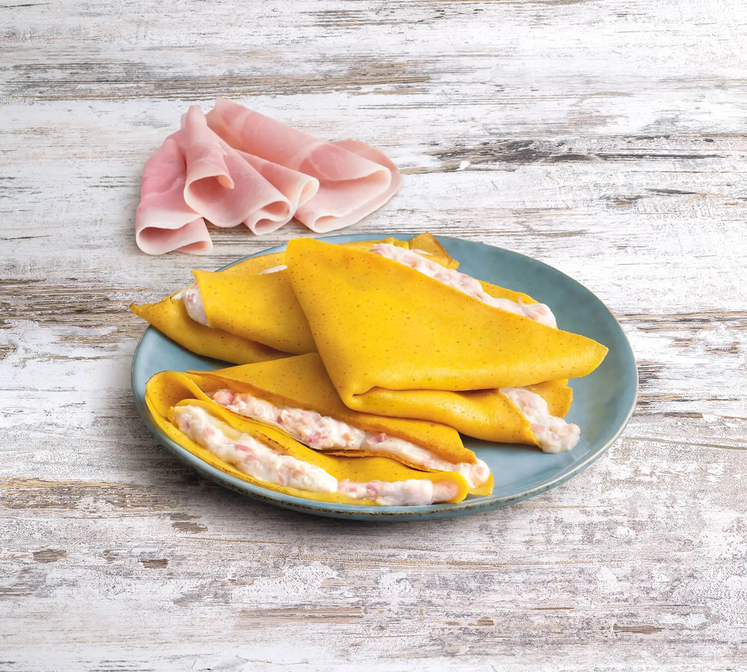 Four crepes with baked ham and cheese