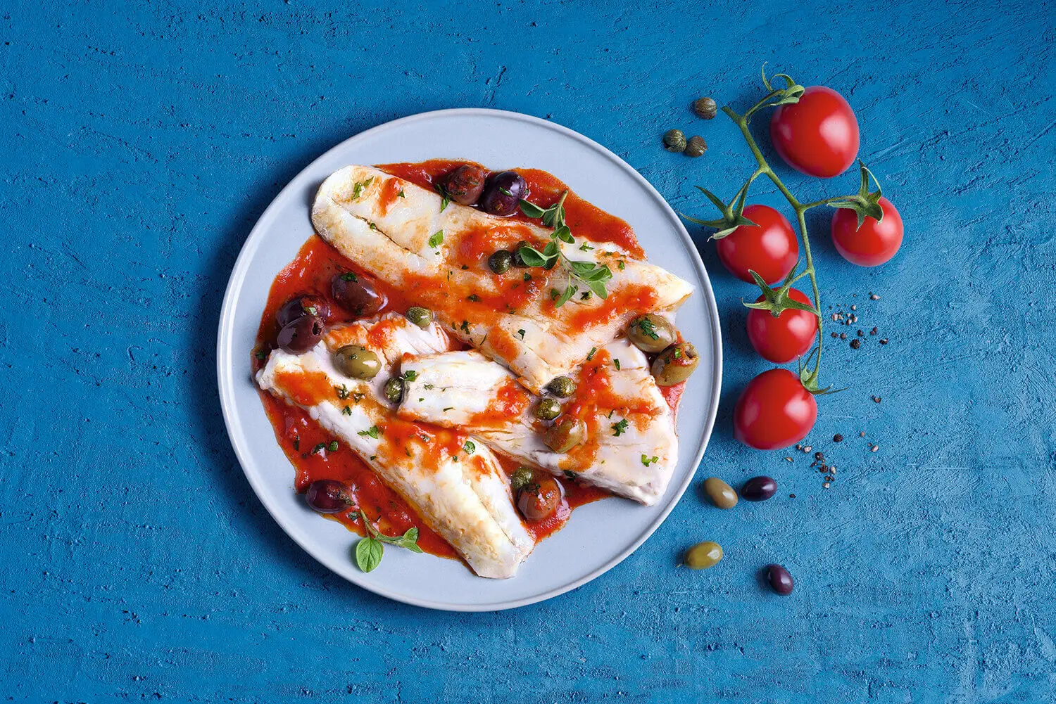 Liguria-style cod with Taggiasche olives and capers